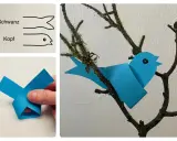Bastelanleitung für einen einfachen Papier-Vogel im Kindergarten. Ein blauer Papier-Vogel sitzt auf einem Ast.