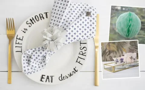 Tischdeko mit Teller "Life is short, eat dessert first", Serviettenring und Kerzen. Ideen zum **Wellen basteln** für eine festliche Tafel.