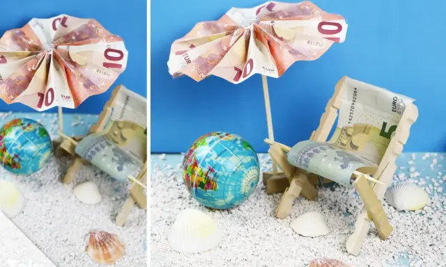 Kreative Ideen: Anker falten Geld zu einer Mini-Strandkulisse mit Liegestuhl und Sonnenschirm aus Euroscheinen.