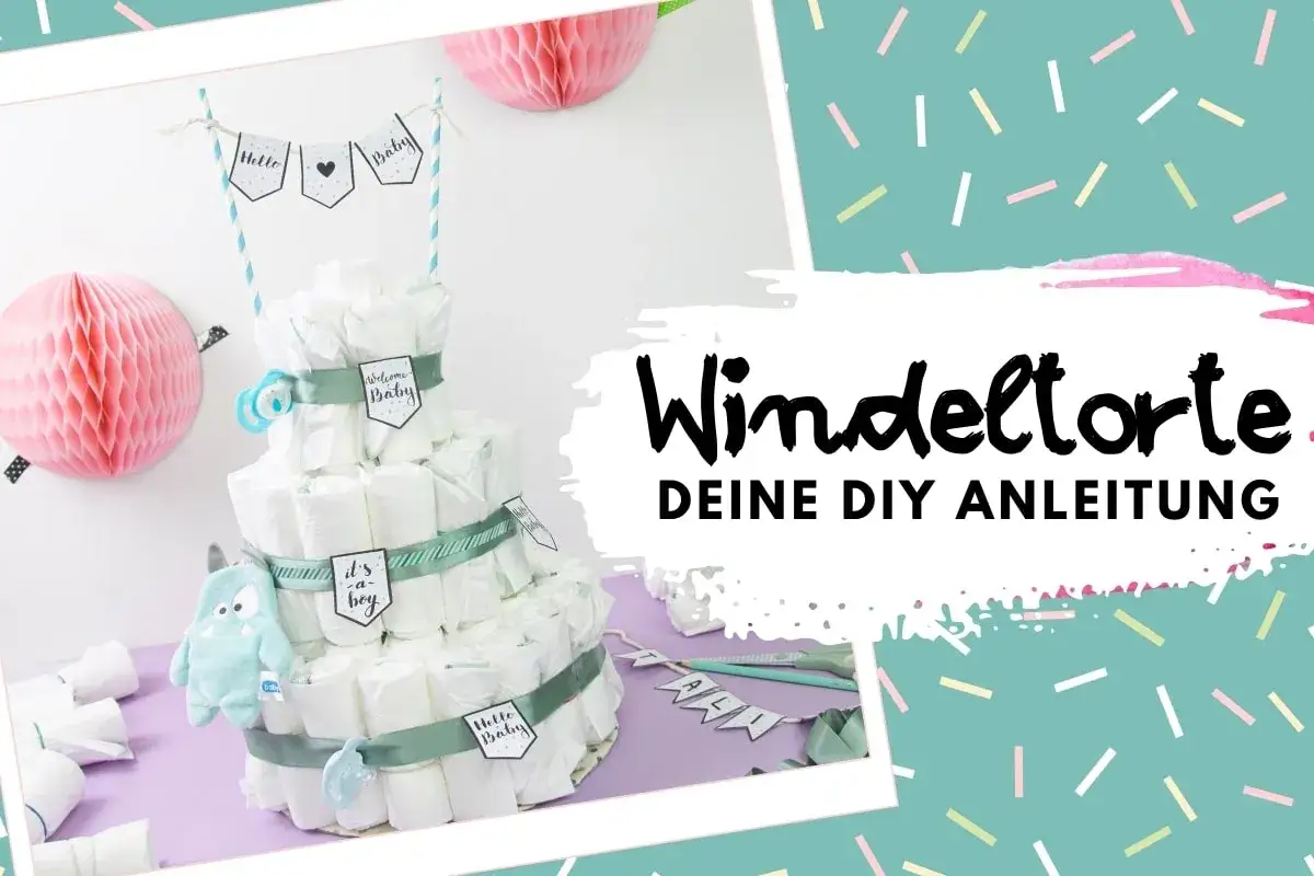 Eine dreist&ouml;ckige Windeltorte mit s&uuml;&szlig;en Anh&auml;ngern und einem kleinen Monster. Perfekt, um eine Windeltorte selber zu machen!