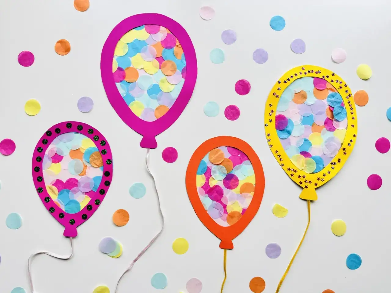 Bunte Ballons aus Papier, gef&uuml;llt mit Konfetti, perfekt zum Basteln f&uuml;r Fasching mit Kleinkindern.